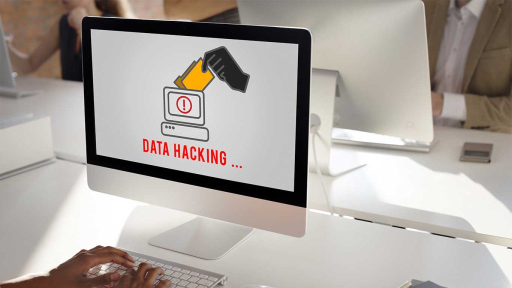 Image d'un ordinateur verrouillé avec un message de rançon affiché, représentant l'attaque de Ransomware, la technique de piratage préférée des hackers